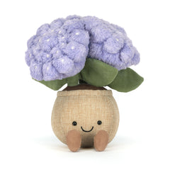 Toy cauliflower with a smiling face on a white background