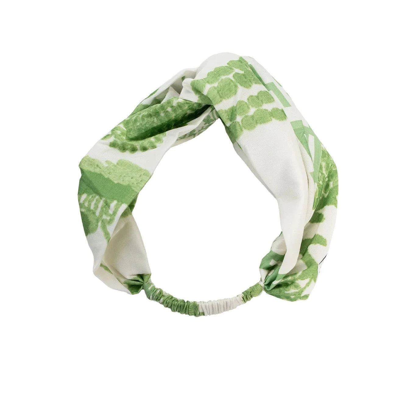 Green and white patterned headband on a white background