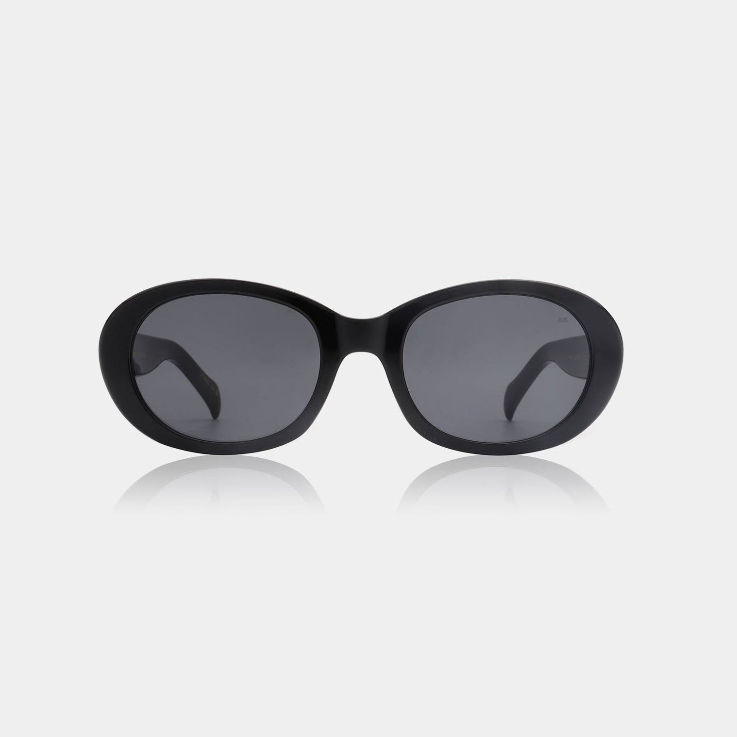 A pair of A.Kjærbede Sunglasses with a rounded frame, displayed against a white background.