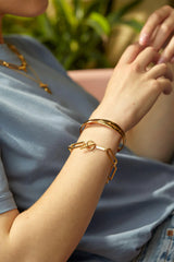 Estella Bartlett Gold Faceted Crossover Bangle