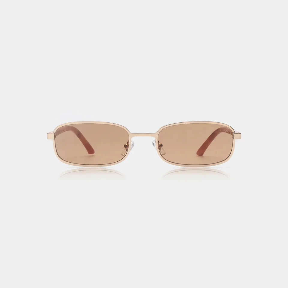 Sunglasses with a gold frame and brown lenses on a white background