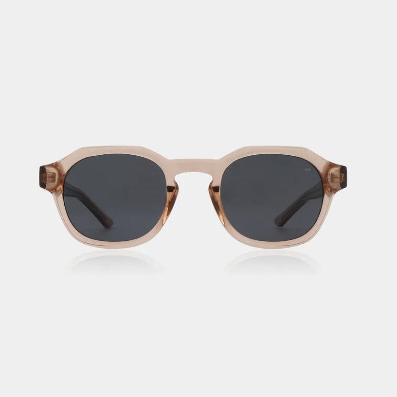 Sunglasses with a beige frame and dark lenses on a white background