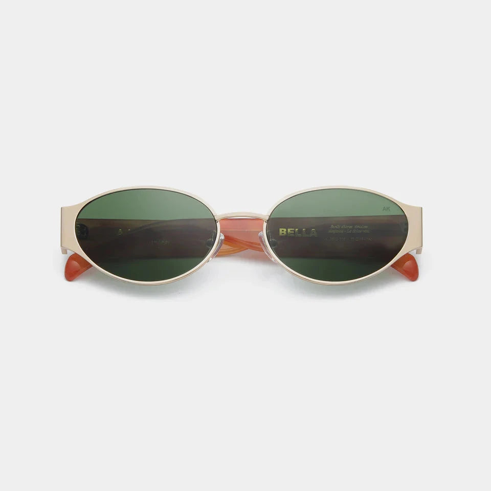 Round sunglasses with a gold frame and green lenses on a white background